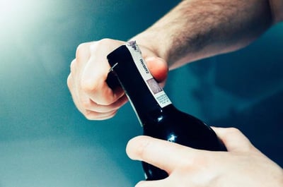 Sommelier Opening Wine Bottle