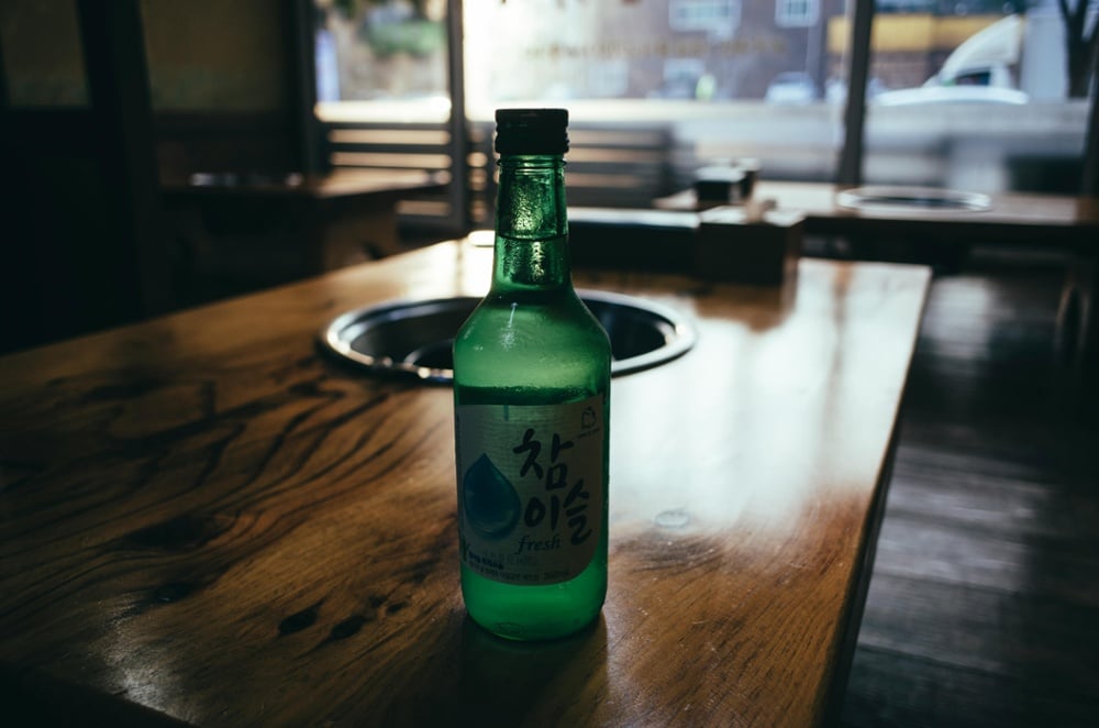 Single bottle of soju on a restaurant table